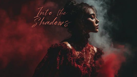 Mysterious woman in red lace gothic dress with “Into the Shadows” text overlay, symbolizing erotic fantasy and forbidden desire